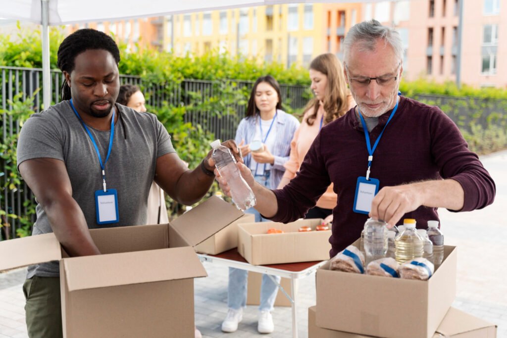 Volunteers sorting boxes of donated water and supplies for families