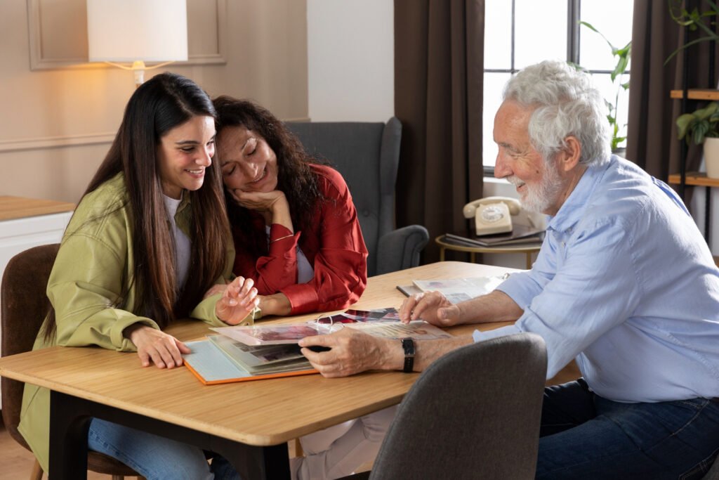 A caseworker helping a young woman and her family review documents at home